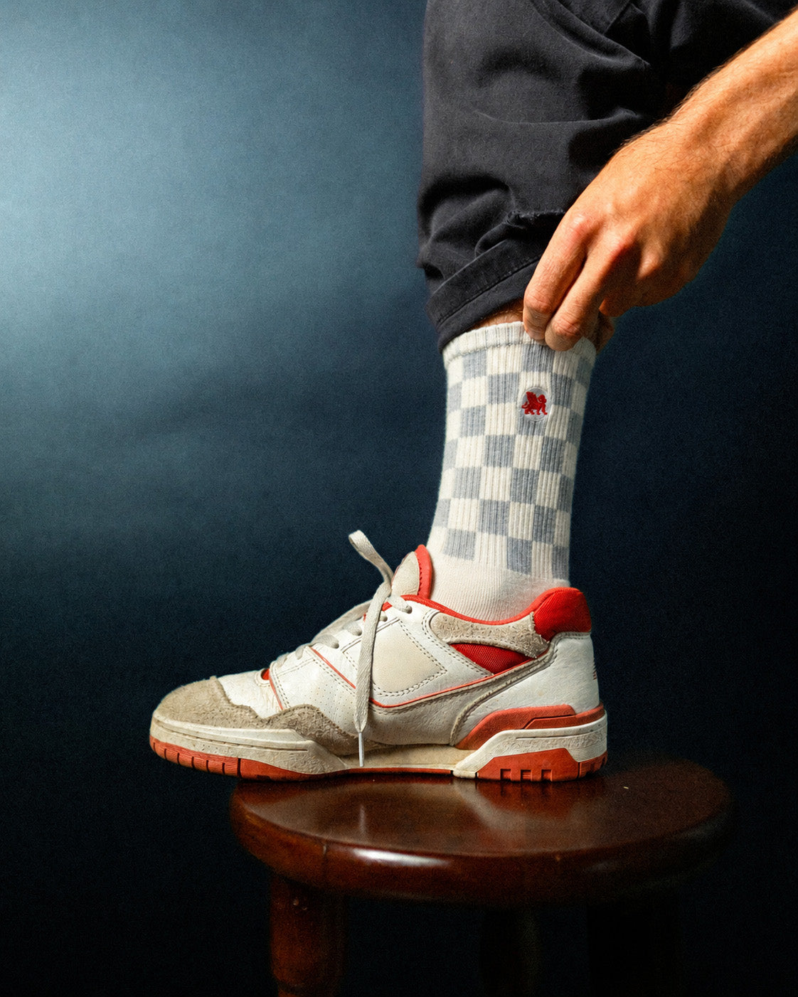 Checkmate crew sock worn with a sneaker